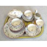 An early 19th Century tea set with tea bowls decorated with cornflowers