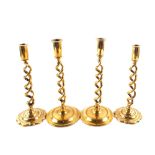 Two pairs of Edwardian open barley twist Brass candlesticks,