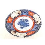 An 18th Century Japanese Imari porcelain charger predominantly painted in underglaze blue and iron