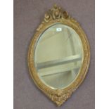 A 19th Century oval giltwood wall mirror