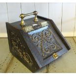 A carved Oak and Brass mounted coal box