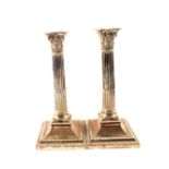 A pair of Victorian Walker and Hall Silver plated Corinthian column candlesticks