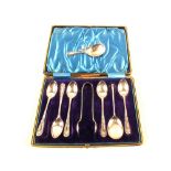 A cased set of six spoons and tongs (one spoon missing) together with a single Silver seal top