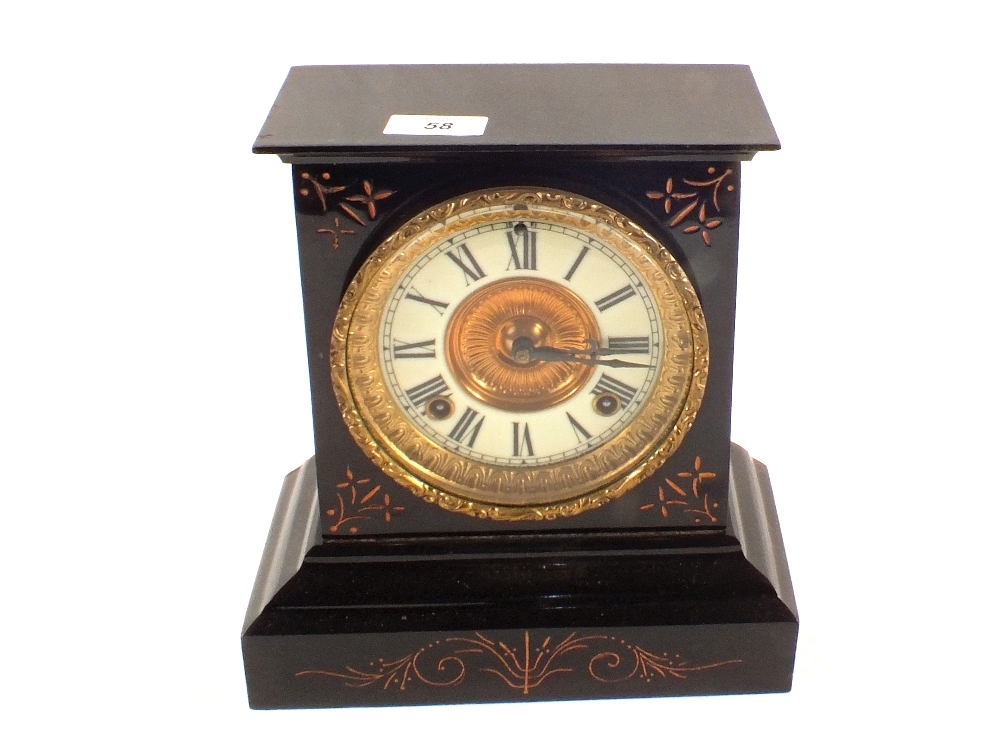 An Ansonia mantel clock in black japanned case