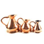 A set of three 19th Century graduated Copper measure jugs