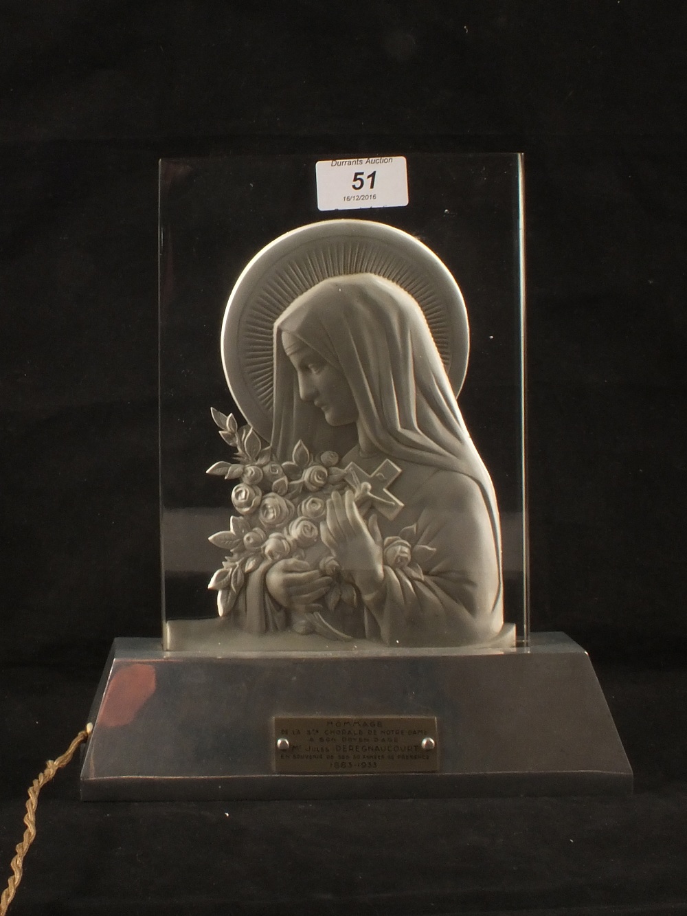 An French illuminated glass plaque with bas relief decoration of the Saint Therese,