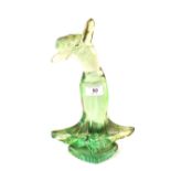 A rare French emerald green glass dancing lady with flared hem by Etling,