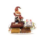 An Iron Mr Punch doorstop plus dominoes,