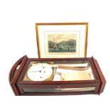 A modern wall clock plus a print of the River Yar,