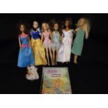 Box containing 6 Barbie Dolls & a Magazine