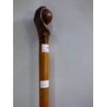walking stick carved as a hand and ball