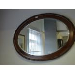 mahogany oval framed mirror