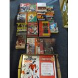 2 boxes of books relating to football