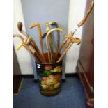 collection of walking sticks in umbrella stand
