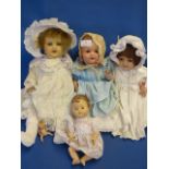 Box containing four porcelain dolls by Amand Marseille and others