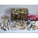 Two trays of assorted costume jewllery and a leather bound jewllery box