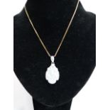 Opal and diamond pendant on chain