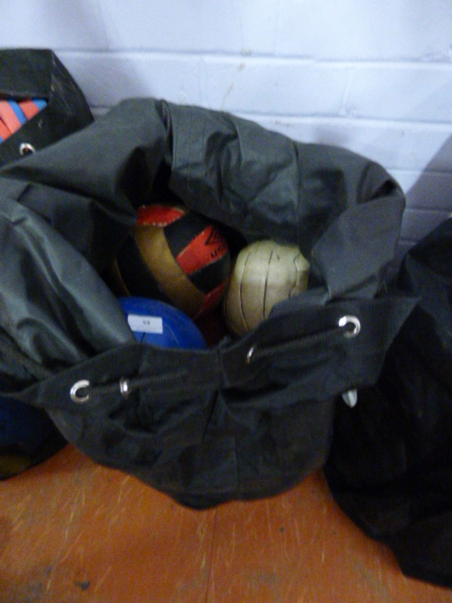 *Bag containing assorted footballs