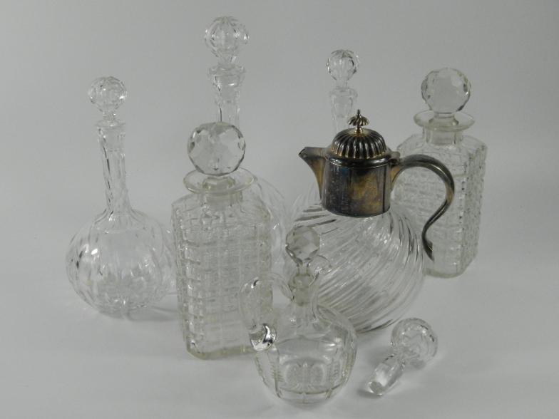 A selection of cut glass decanters, each with stopper, together with a cut glass spiral fluted