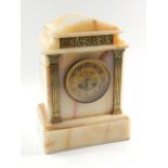 A Victorian white marble cased mantel clock, of architectural form with an embossed frieze of