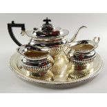 A plated semi fluted three piece tea set, comprising; teapot, cream jug and sugar bowl, and an