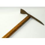 A German mountaineer's pick axe, early 20thC, wooden shafted, impressed marks, 83cm long.
