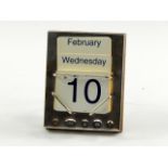 A silver backed perpetual calendar, with easel back support, Carrs, Sheffield 2000.