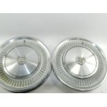 A set of four Cadillac Deville hub caps, circa 1960's, 41.5cm diameter.