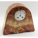 A French red variegated marble mantel clock, early 20thC, of domed form with brass overlay, circular