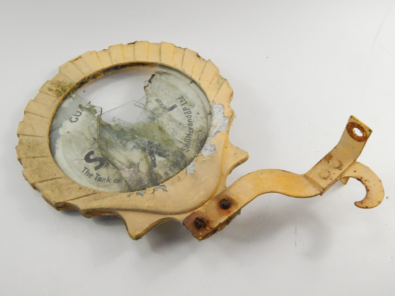 A 1930's Shell Mex wall bracket, to display pump contents, 26cm diameter.