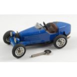 A modern Shuco Studio IV Bugatti 35B clockwork model car.