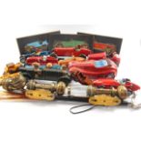 Wooden models of vintage racing cars, biscuit tin, shoe horn and pair of brass lamps.