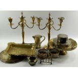 A quantity of plated wares, comprising; a pair of three branch candelabra, ten place mats and