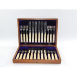 A George V silver fish canteen of cutlery, with ivory handles, oak cased for Curtis & Horspool,
