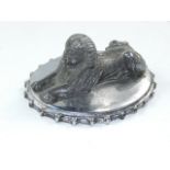 A Hawker Siddeley cast metal car mascot, modelled as a Sphinx, on a serrated oval base, 9.5cm long.