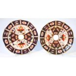 Two Royal Crown Derby Old Imari pattern plates, each 18cm wide, printed marks beneath. (2)