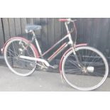 A mid-20thC ladies Royal Enfield Junior Champion bike, picked out in red, black and white, with