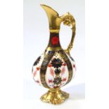A Royal Crown Derby Old Imari pattern ewer, the circular body with gilt spout and handle on shaped