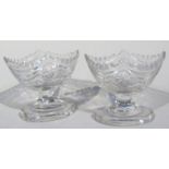 A pair of George III cut glass open salts, each of boat shaped outline on oval feet, 8cm high. (2)