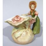 An early 20thC Royal Dux jug, with maiden handle she in bonnet overlooking a floral bowl, of