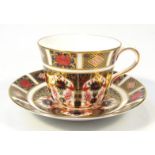 A Royal Crown Derby Imari pattern tea cup and saucer, 16cm dia. no. 1128, printed marks beneath. (