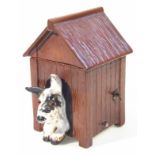 A Crown Devon Fieldings musical kennel box, with removable lid and fronted by a dog, predominately
