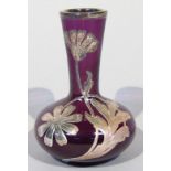 A late 19thC amethyst and overlay glass vase, raised with white metal flowers and leaves, with an
