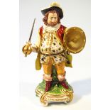 An early 19thC Derby figure of Falstaff, in standing pose, he polychrome decorated in purple,