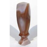 A polished agate seal, with shaped handle and plain octagonal terminal, in textured brown and cream,