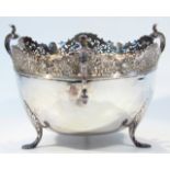 An Edwardian silver bowl, by Walker & Hall, with triple scroll thumb print handles and an upper