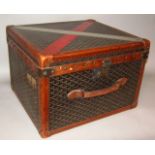 A 20thC Goyard hat box, the square body with a leather outline with studded corners and an arrow