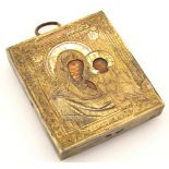 A late 19thC miniature Russian icon, the textured rectangular metal outline set with figures of