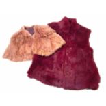 A Kessly fur style waistcoat, quarter length with short sleeves, in burgundy, and a shoulder