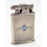 An early 20thC Ronson pocket lighter, centred by RAF wings picked out in blue and red, with a